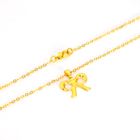 Conjunto Colar e Brinco Lacinho Detalhado Banhado a Ouro