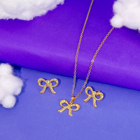 Conjunto Colar e Brinco Lacinho Detalhado Banhado a Ouro